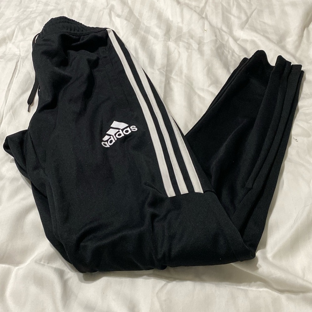 Adidas girls size xs joggers with zip up pocket and calves.